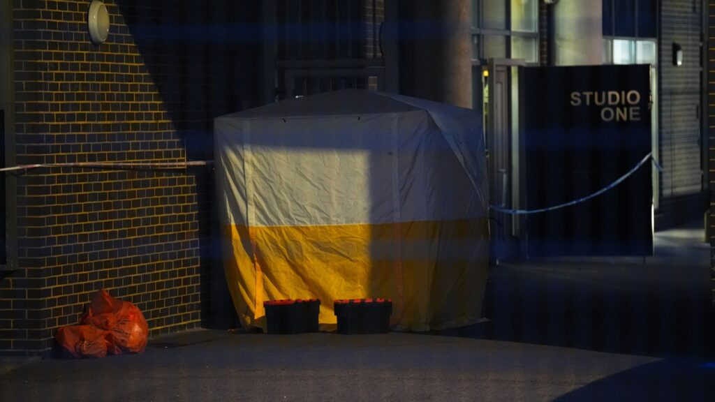 A police forensic tent at the scene on Monday night. Pic: PA